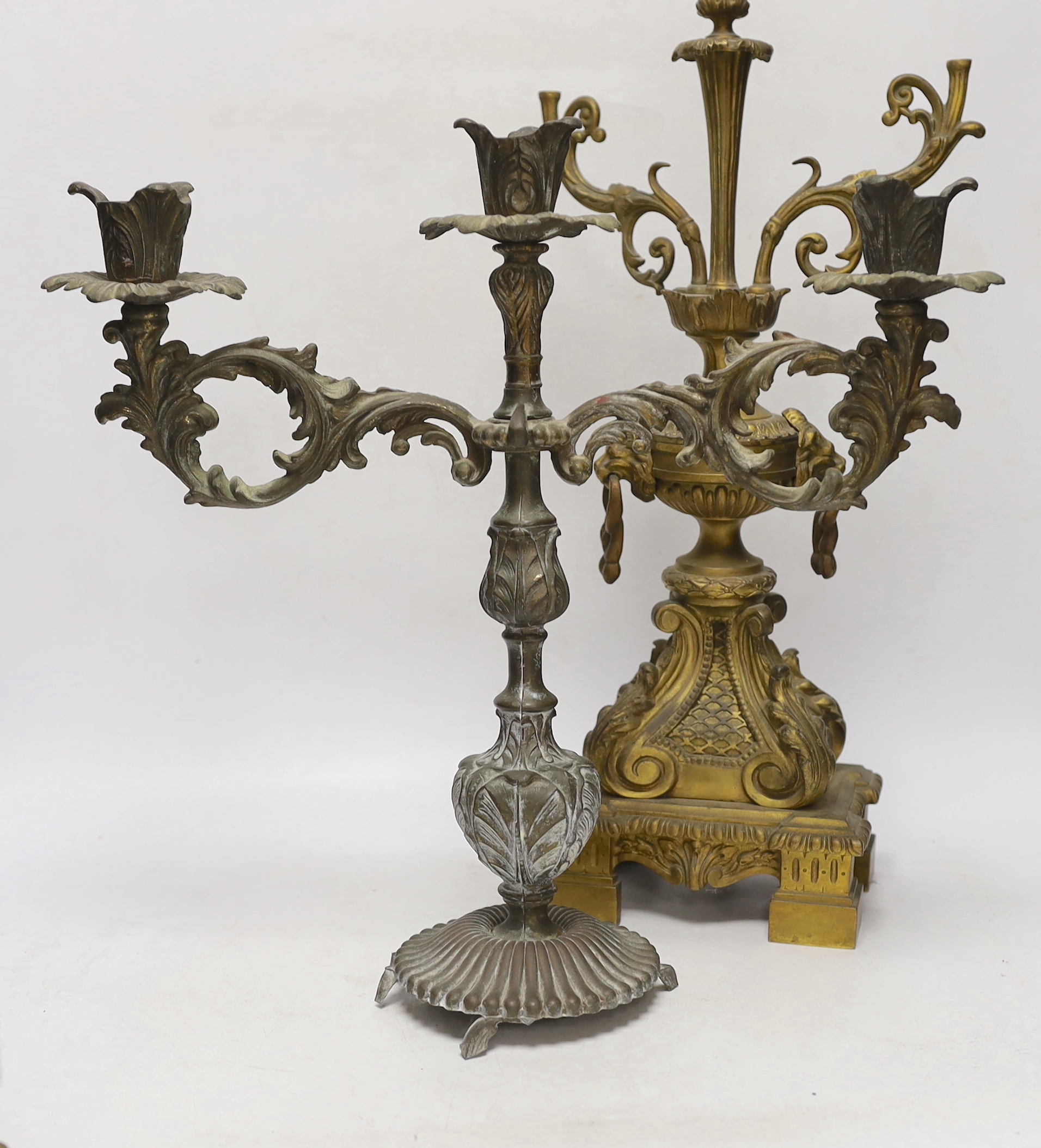 A pair of brass lustre drop candlesticks, lamp base and three branch candelabra, 59cm high